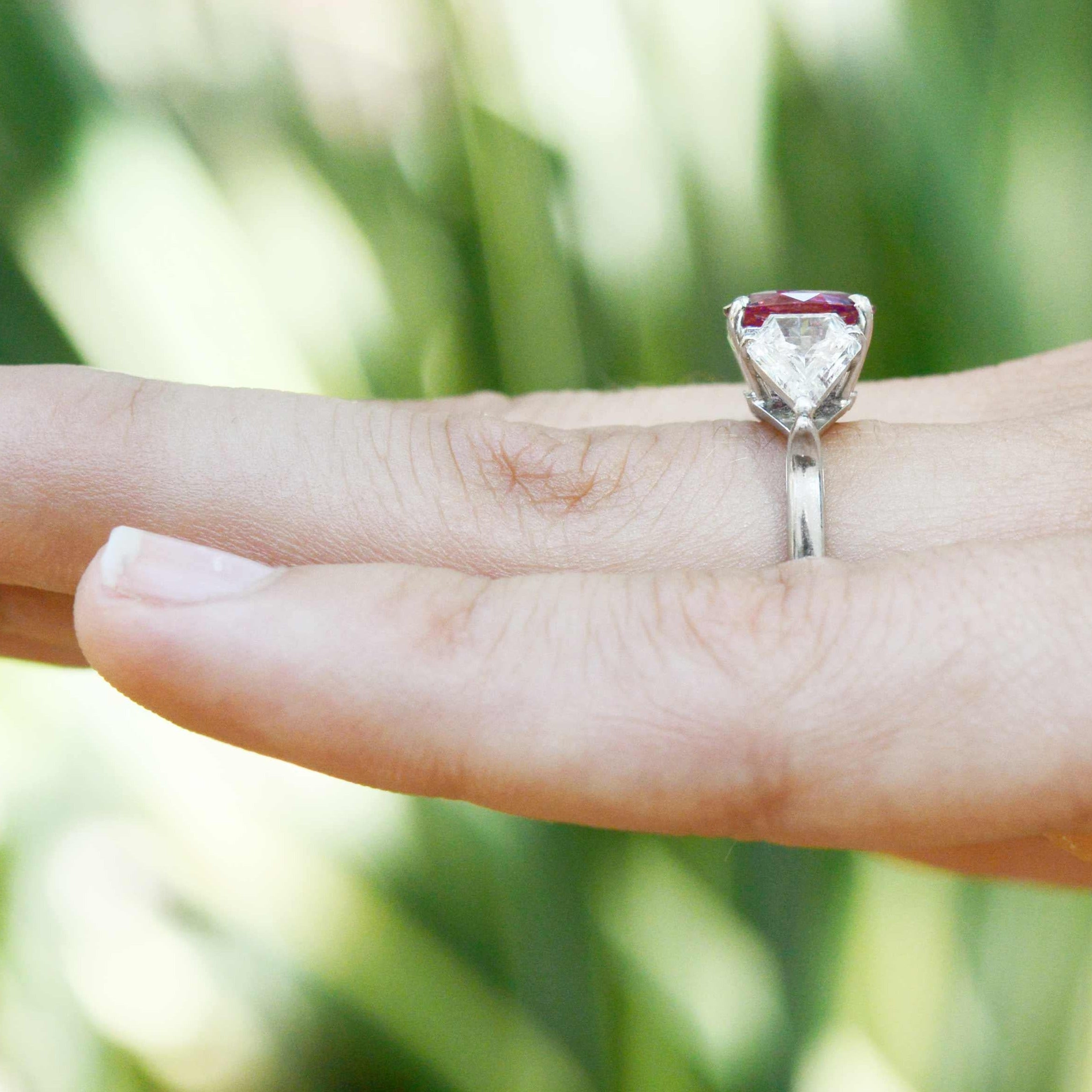 A handcrafted platinum 3 stone diamond and sapphire solitaire ring setting.