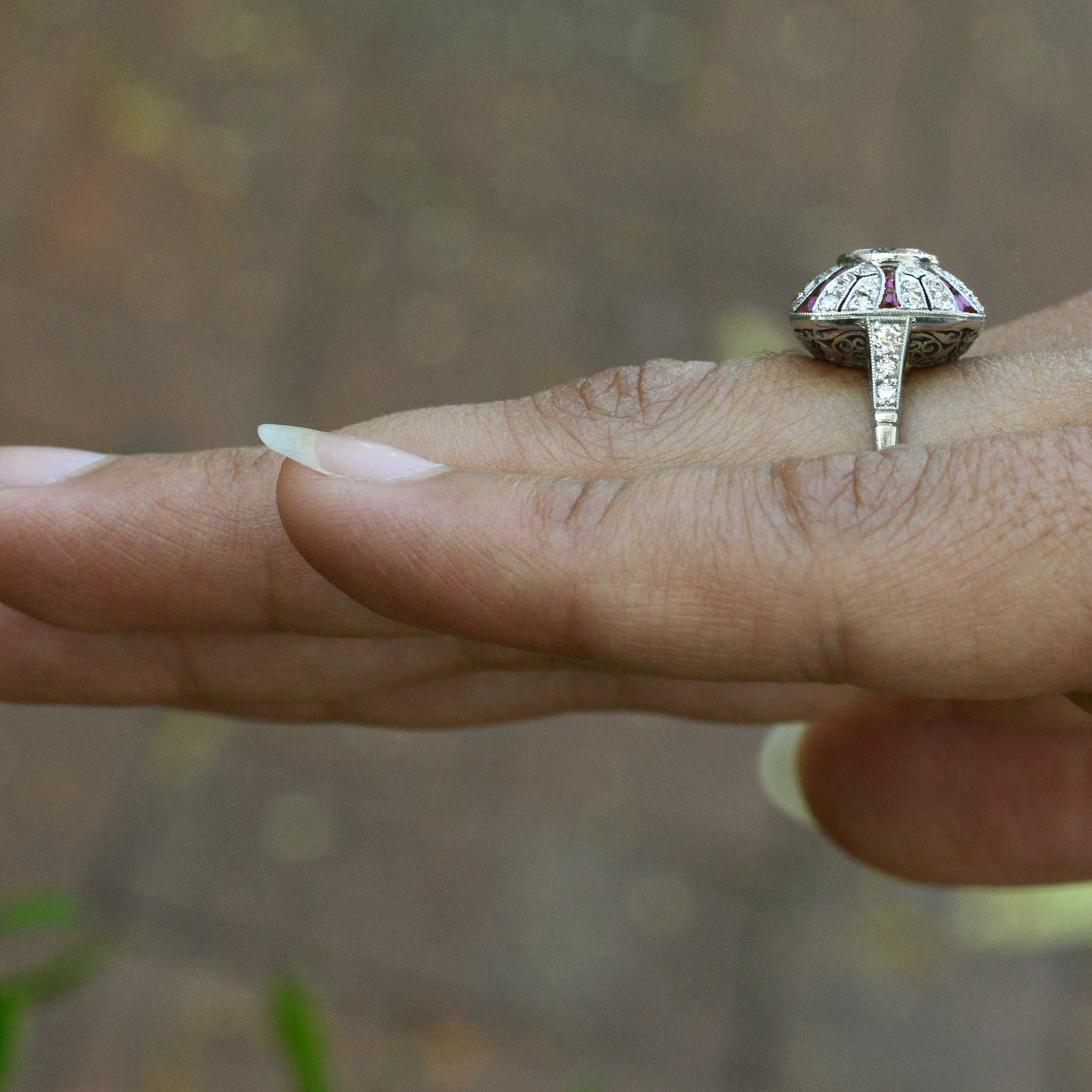 This diamond Art Deco style bombe ring has ruby stripes.