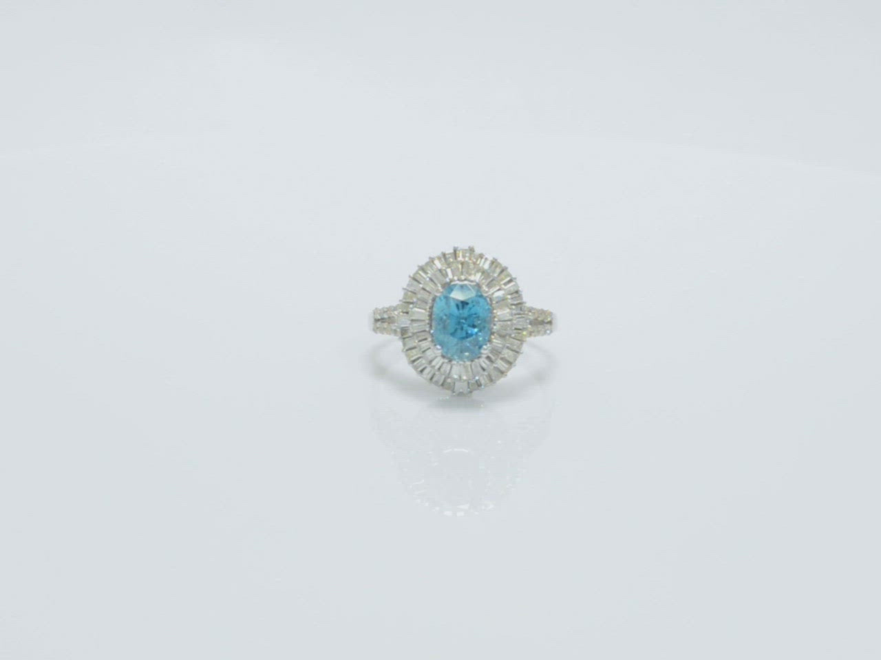 This large, five carat blue zircon is surrounded 2 halos of diamonds.