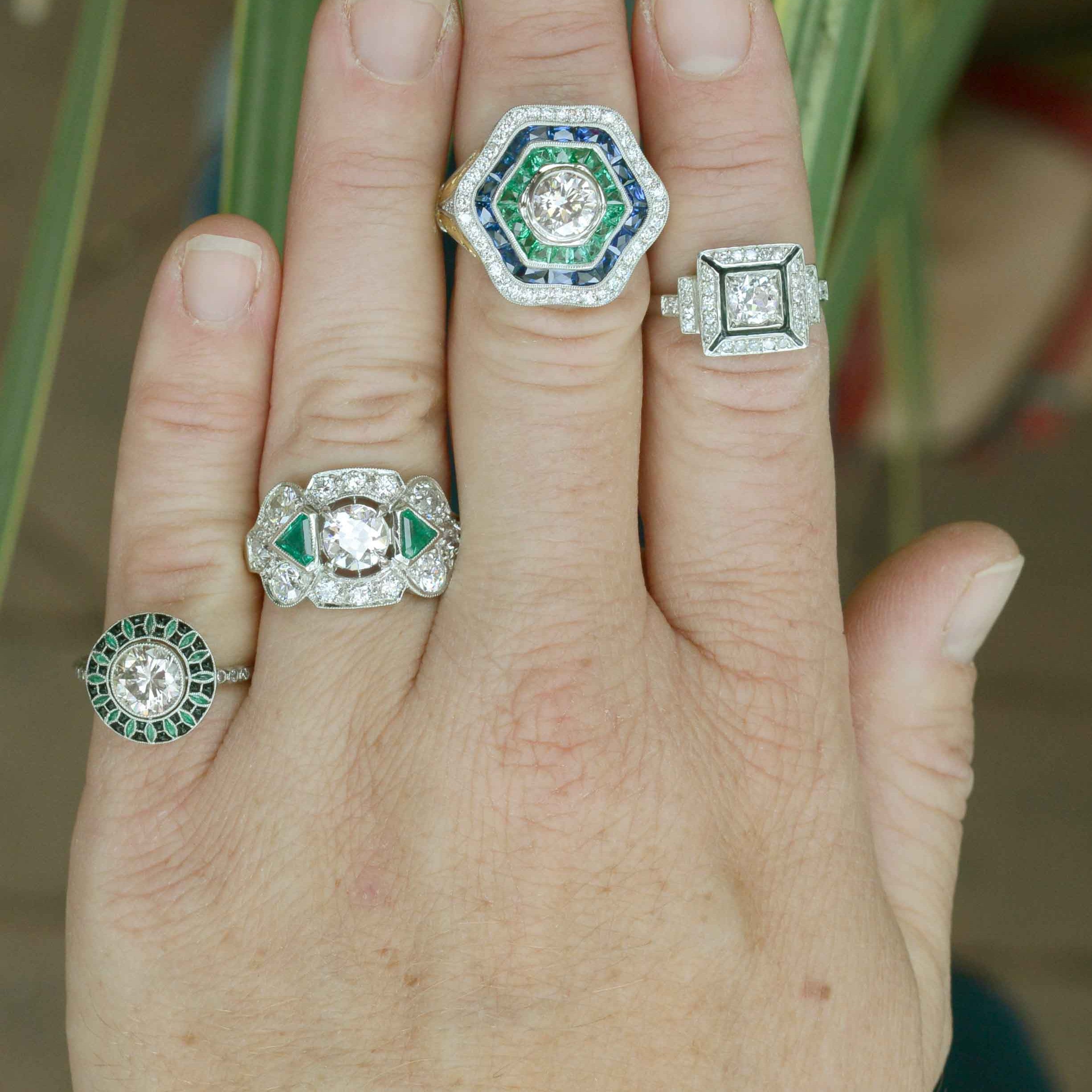 Diamond engagement rings with emeralds.