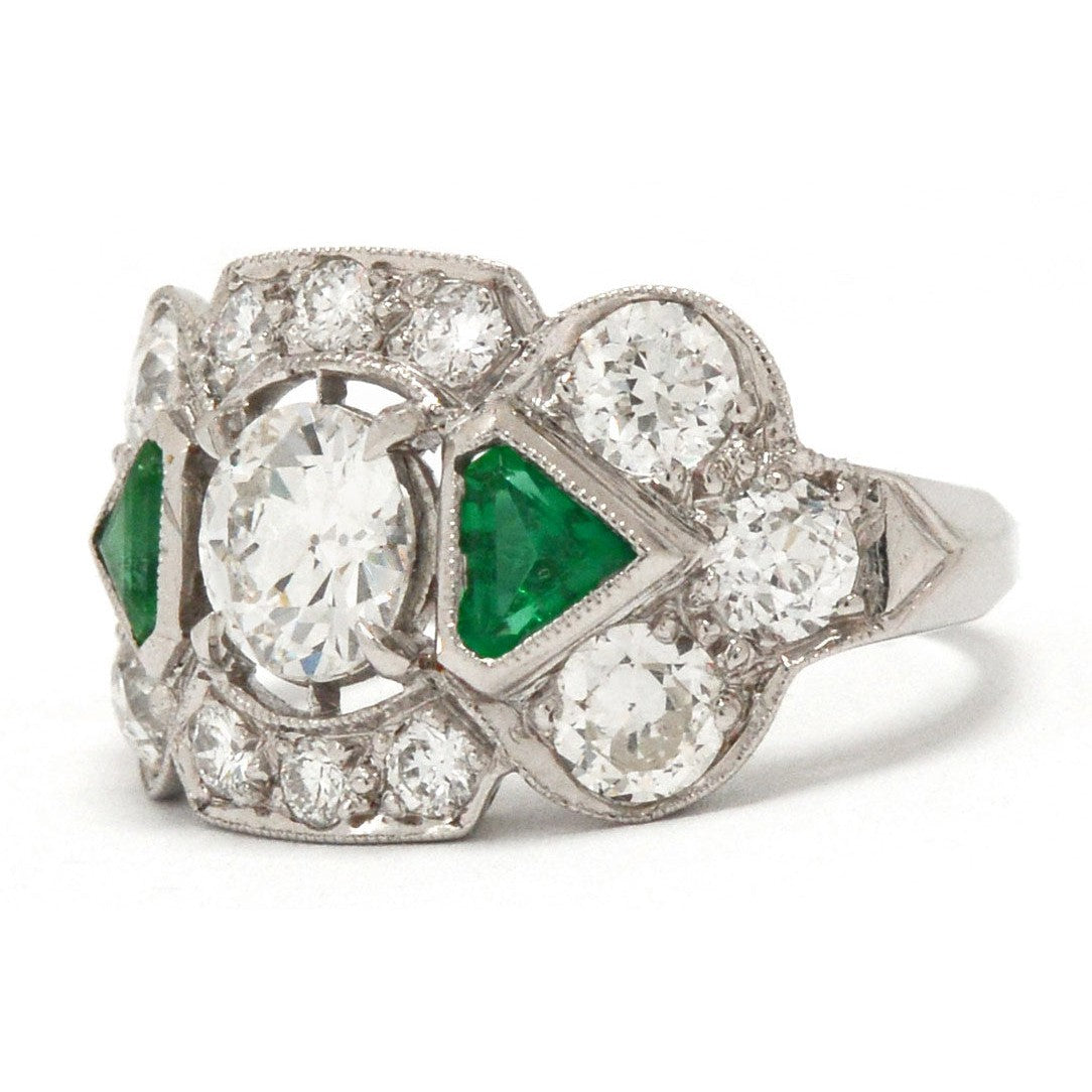 Triangle step cut emeralds diamond engagement ring.