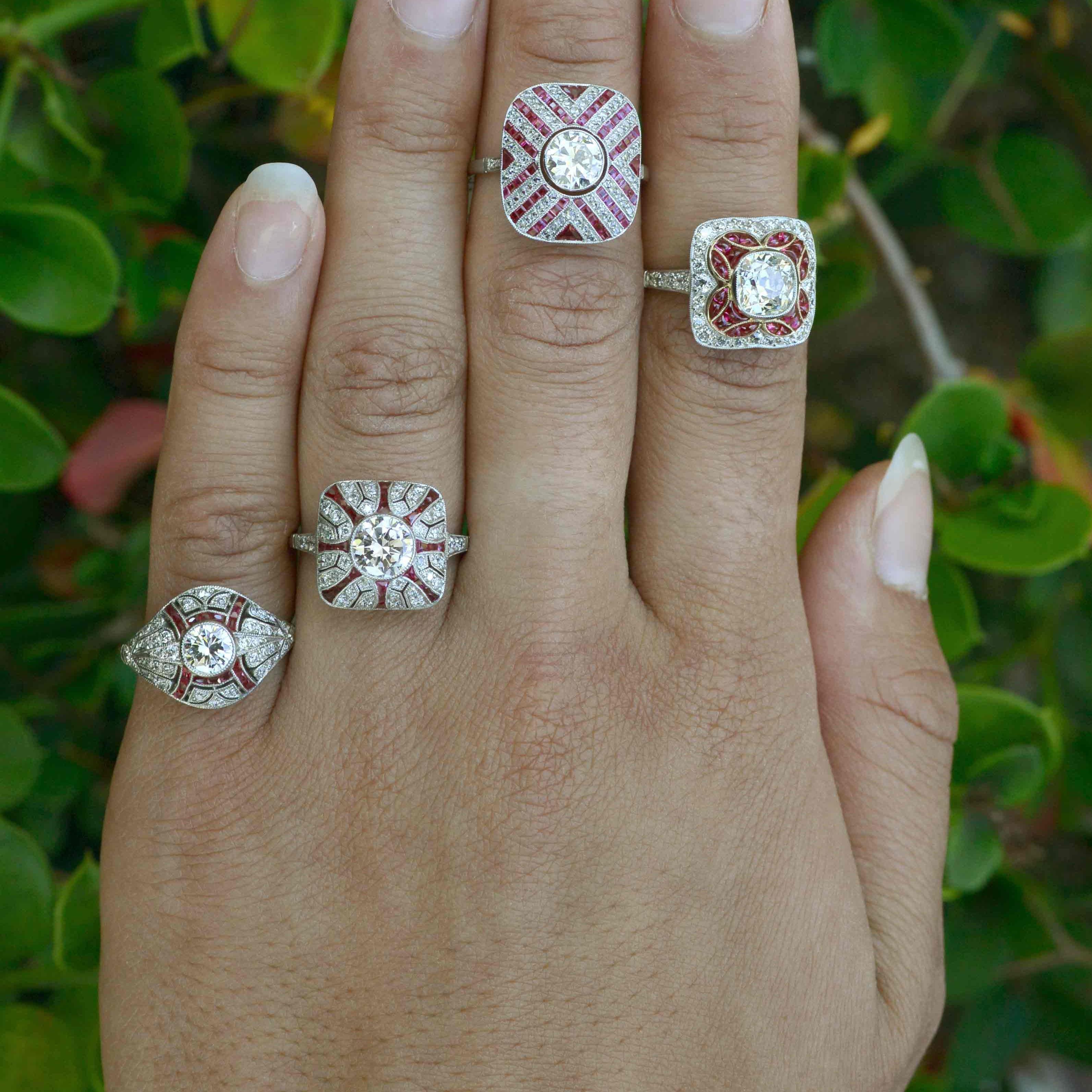 A collection of unique diamond and ruby halo wedding rings.