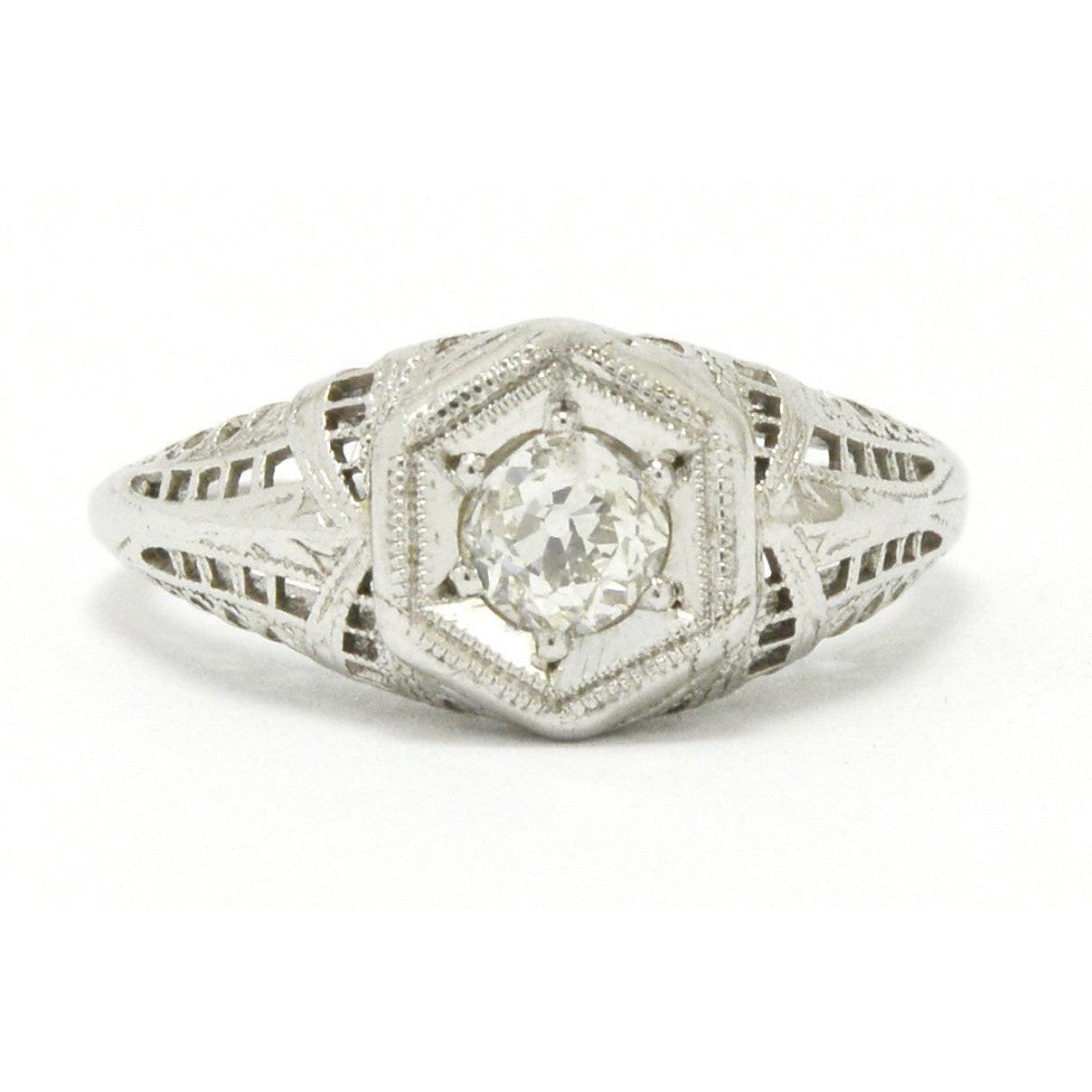 Diamond hexagon filigree 18k white gold engagement ring.