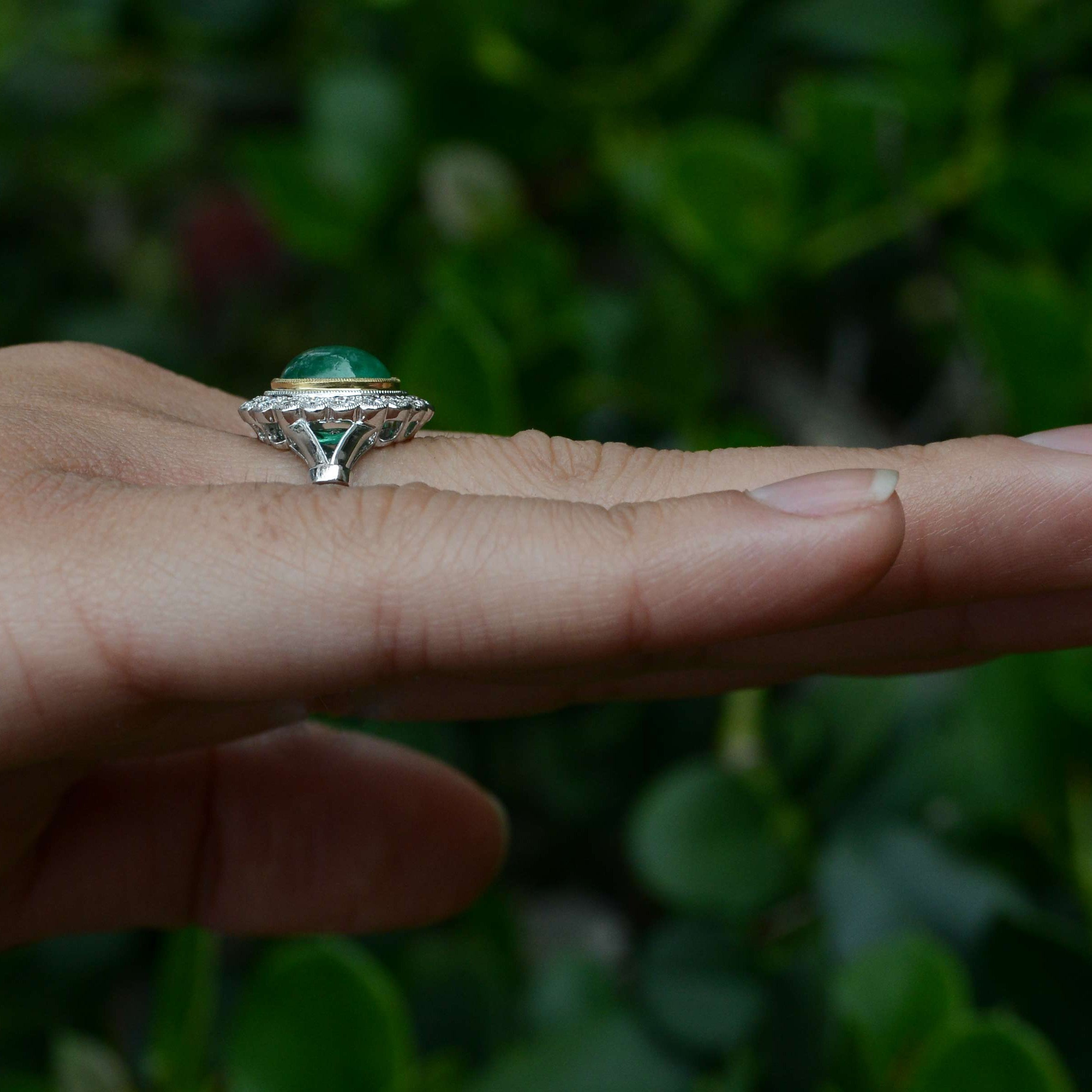 A 2 carat oval cabochon emerald statement ring.