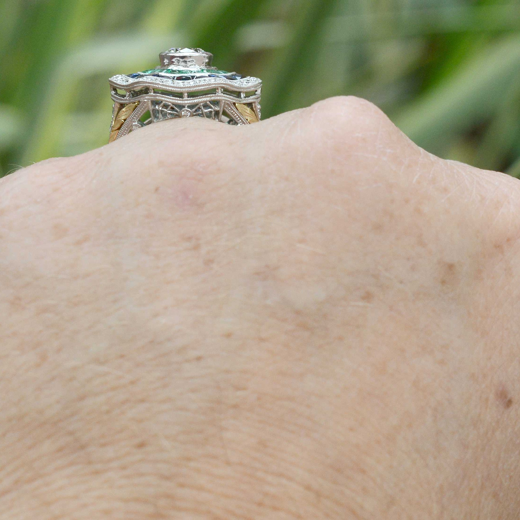 A platinum and gold filigree undergallery of this statement ring.