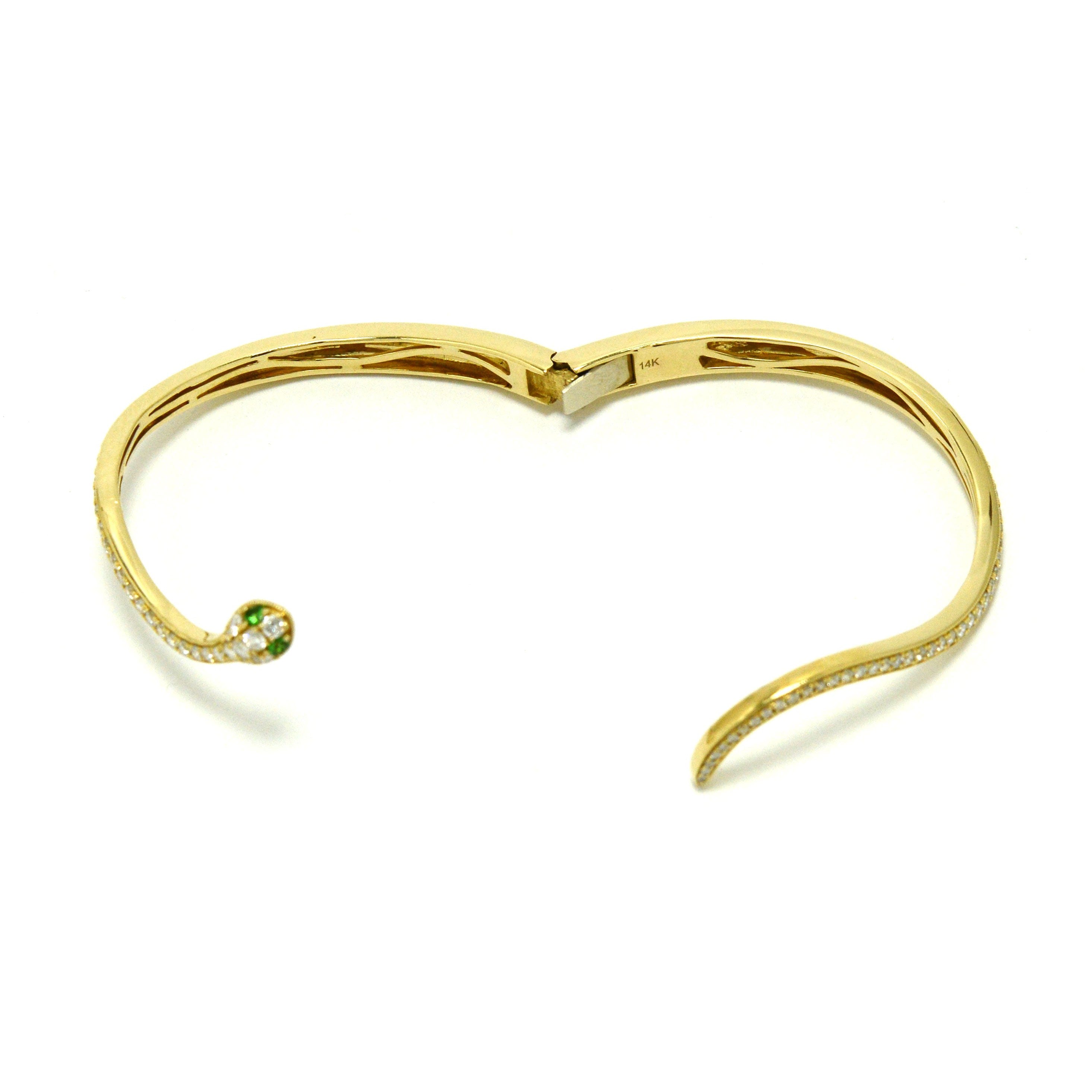 This gold snake bracelet has an engraved marking 14k.