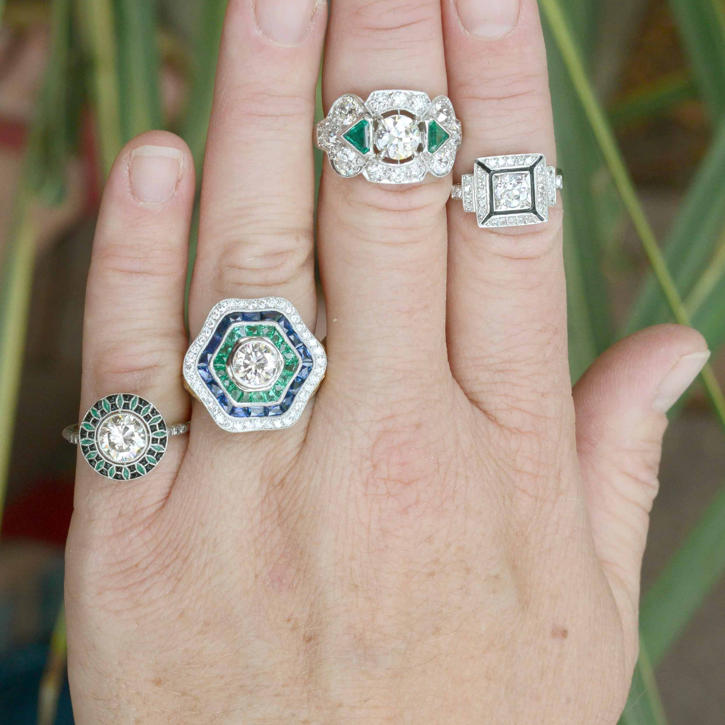 A collection of unique diamond and emerald platinum statement rings.