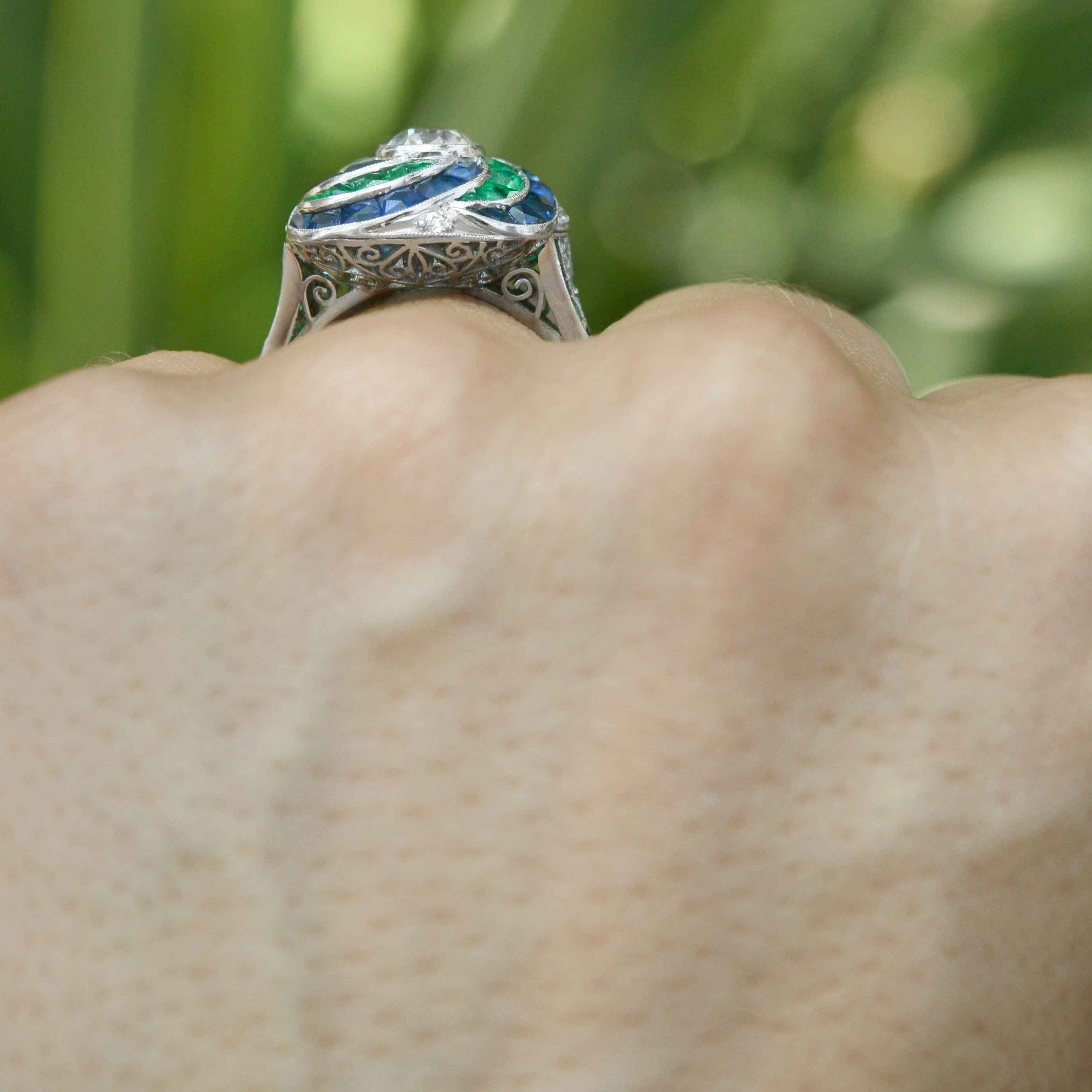 A unique one carat diamond platinum engagement ring with a filigree undergallery.