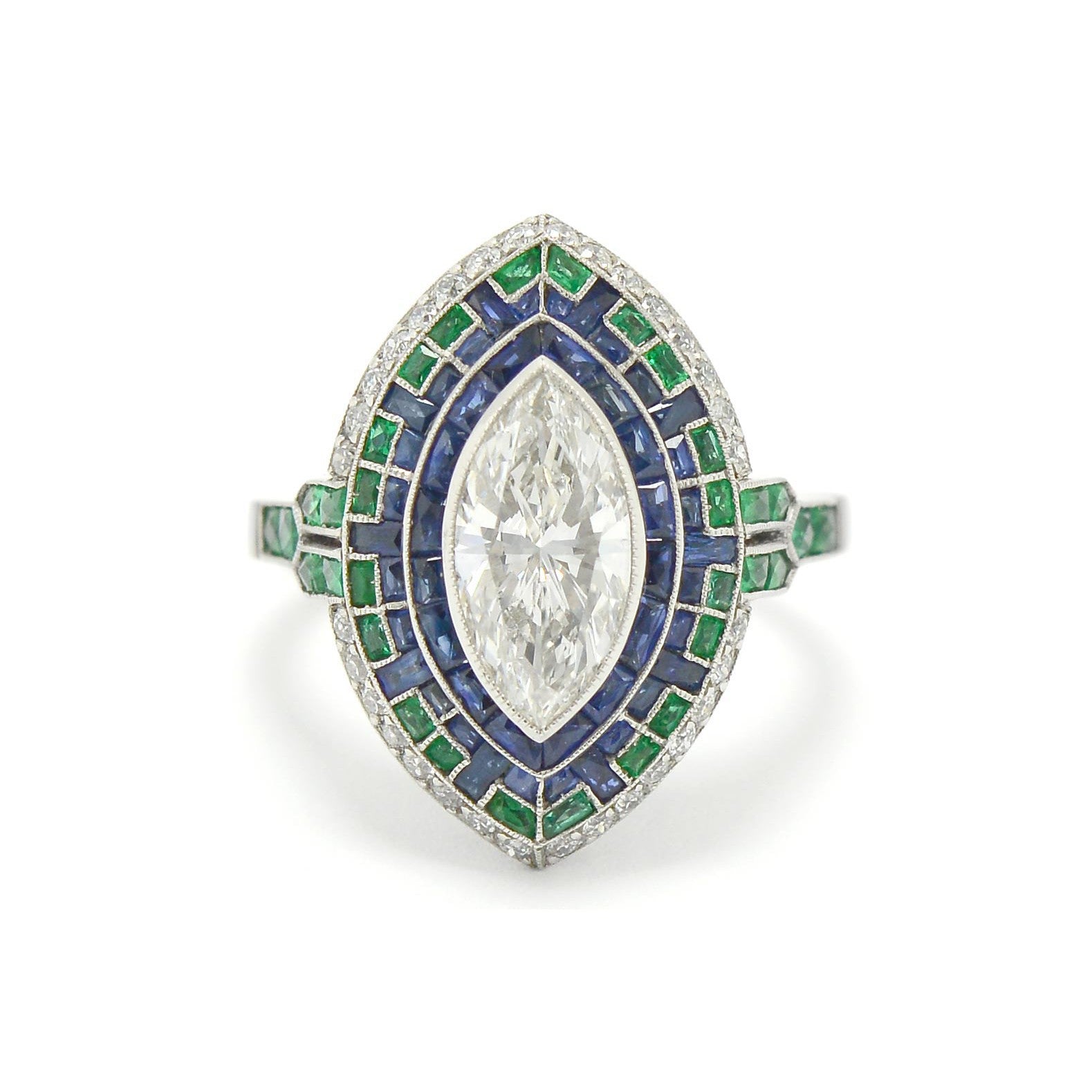 A 4 carat marquise cut diamond in a sapphire and emerald Art Deco mosaic engagement ring.