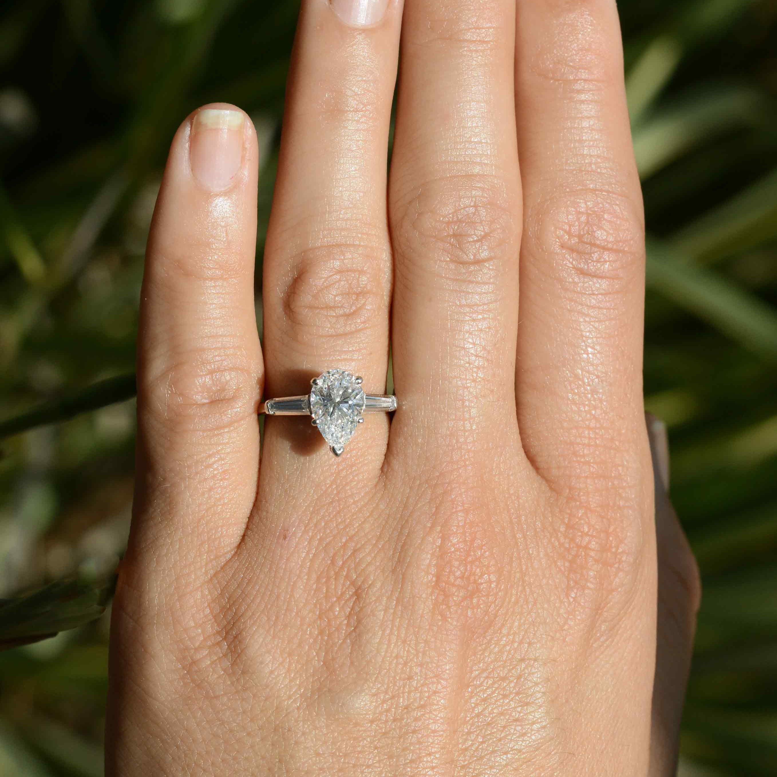 This pear diamond, set in a platinum solitaire, has excellent color and clarity.