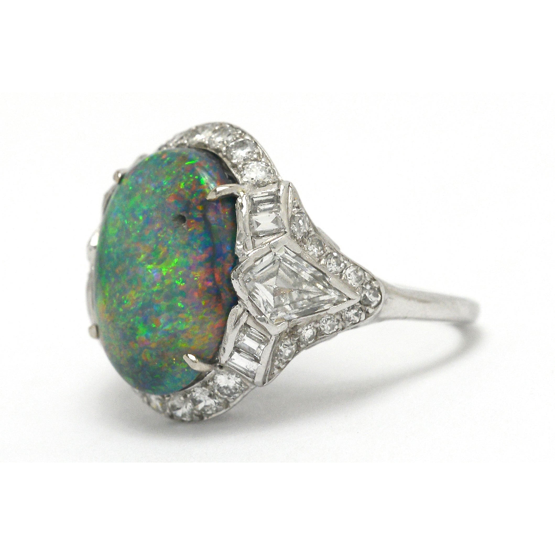 Dome black opal cocktail ring with kite and baguette diamonds.