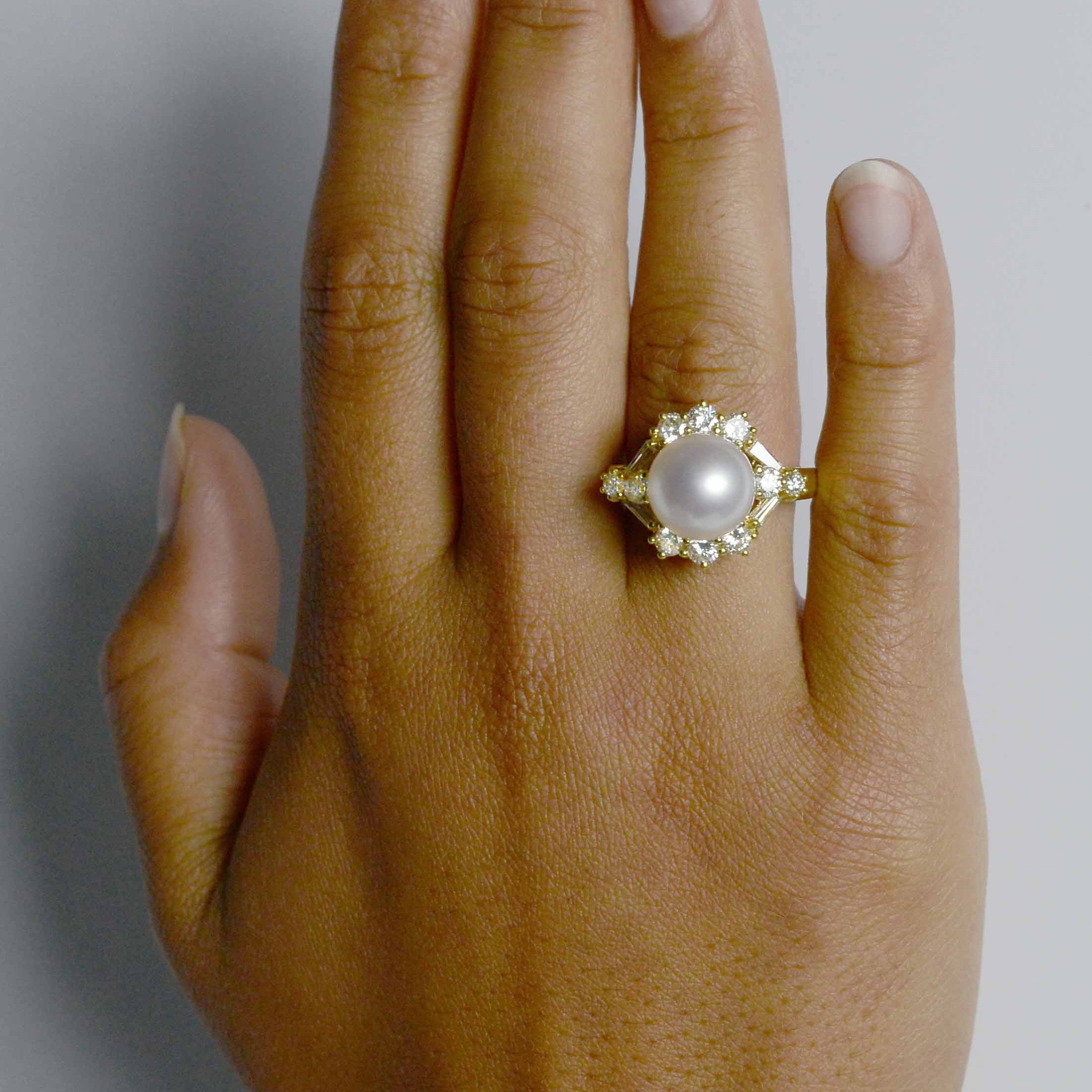 1 carat of diamonds create a halo around this modern natural pearl cocktail ring.