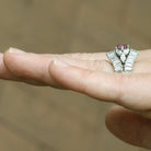 A floral, pink sapphire platinum vintage cocktail ring.