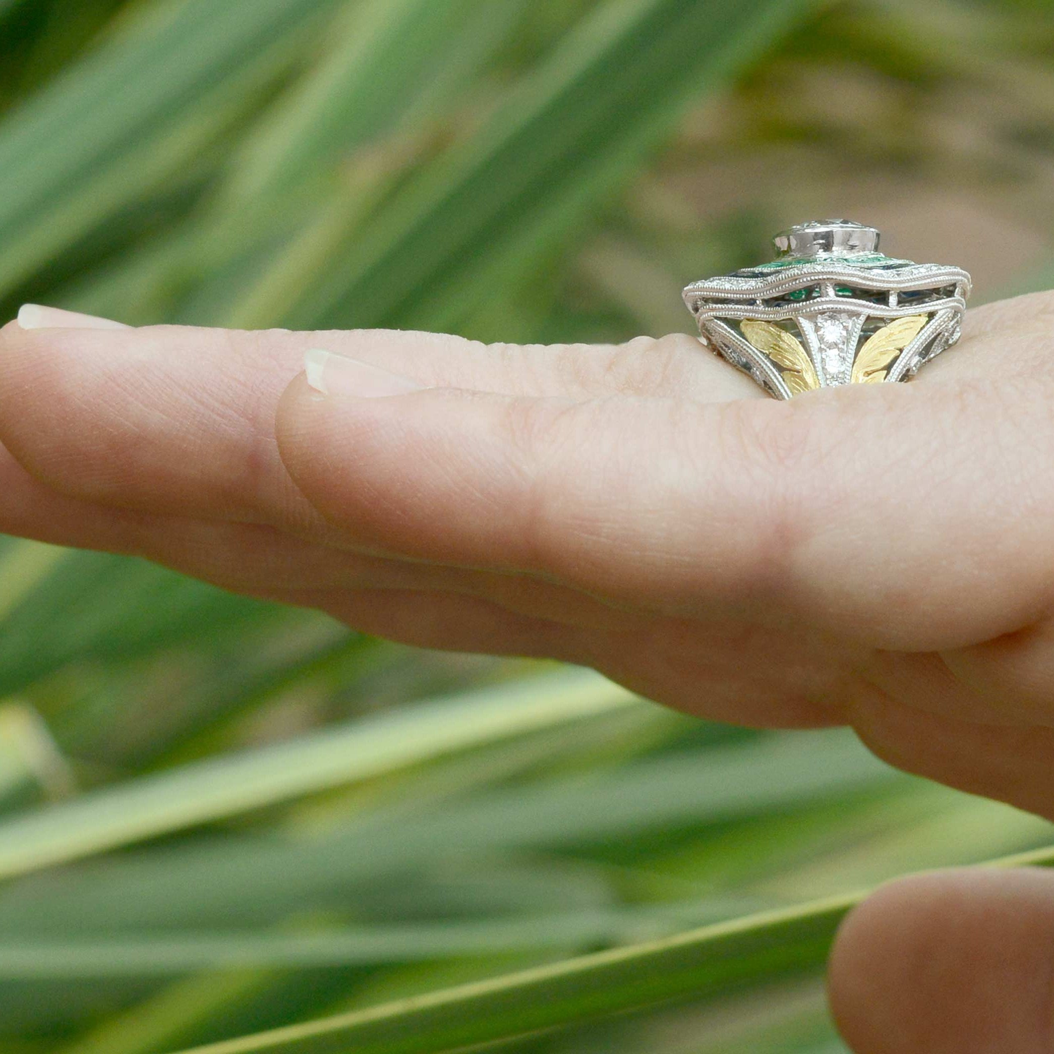 Gold leafs accent the filigree diamond Art Deco statement ring.