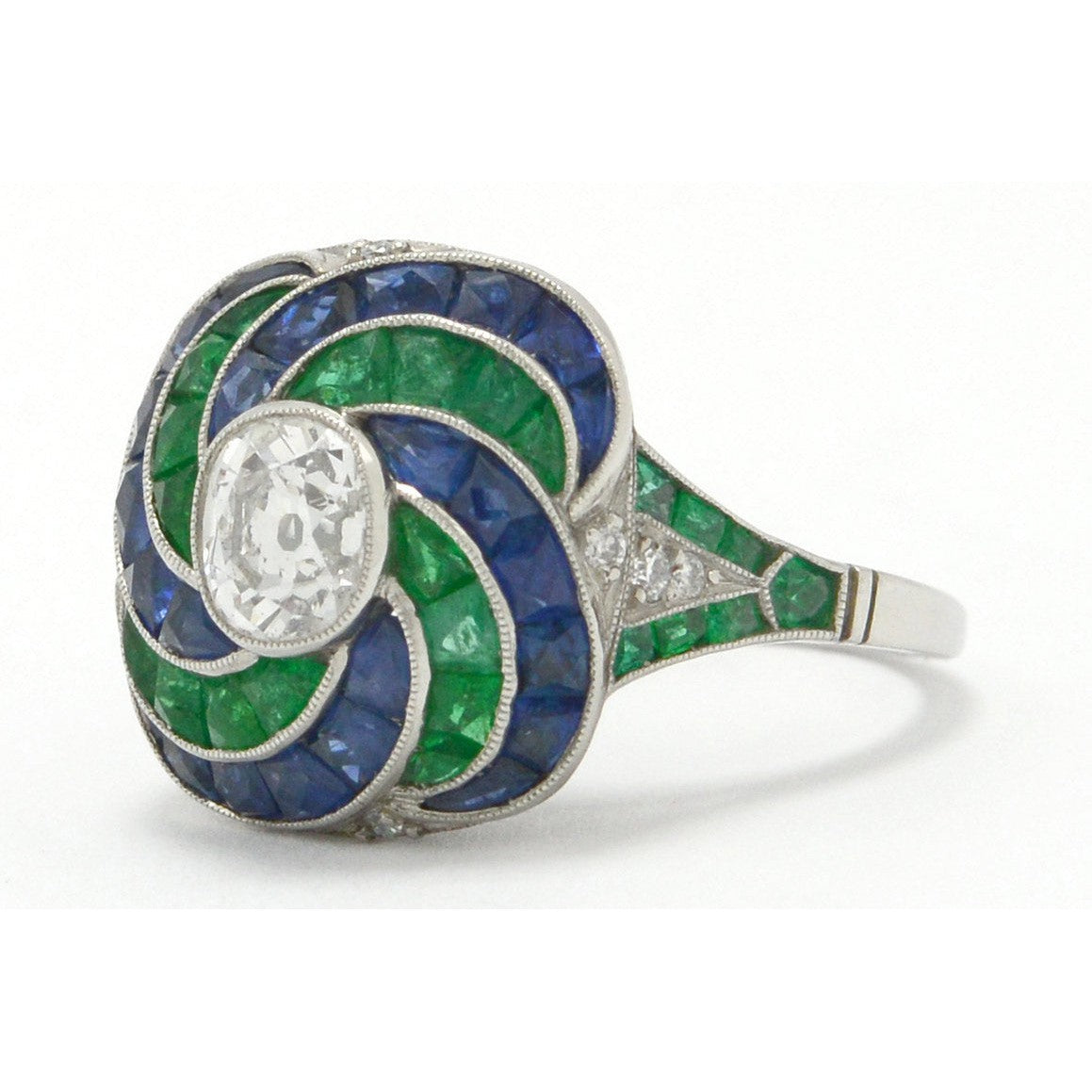 There is 4 carats of emeralds, sapphires and diamonds in this Art Deco revival wedding ring.