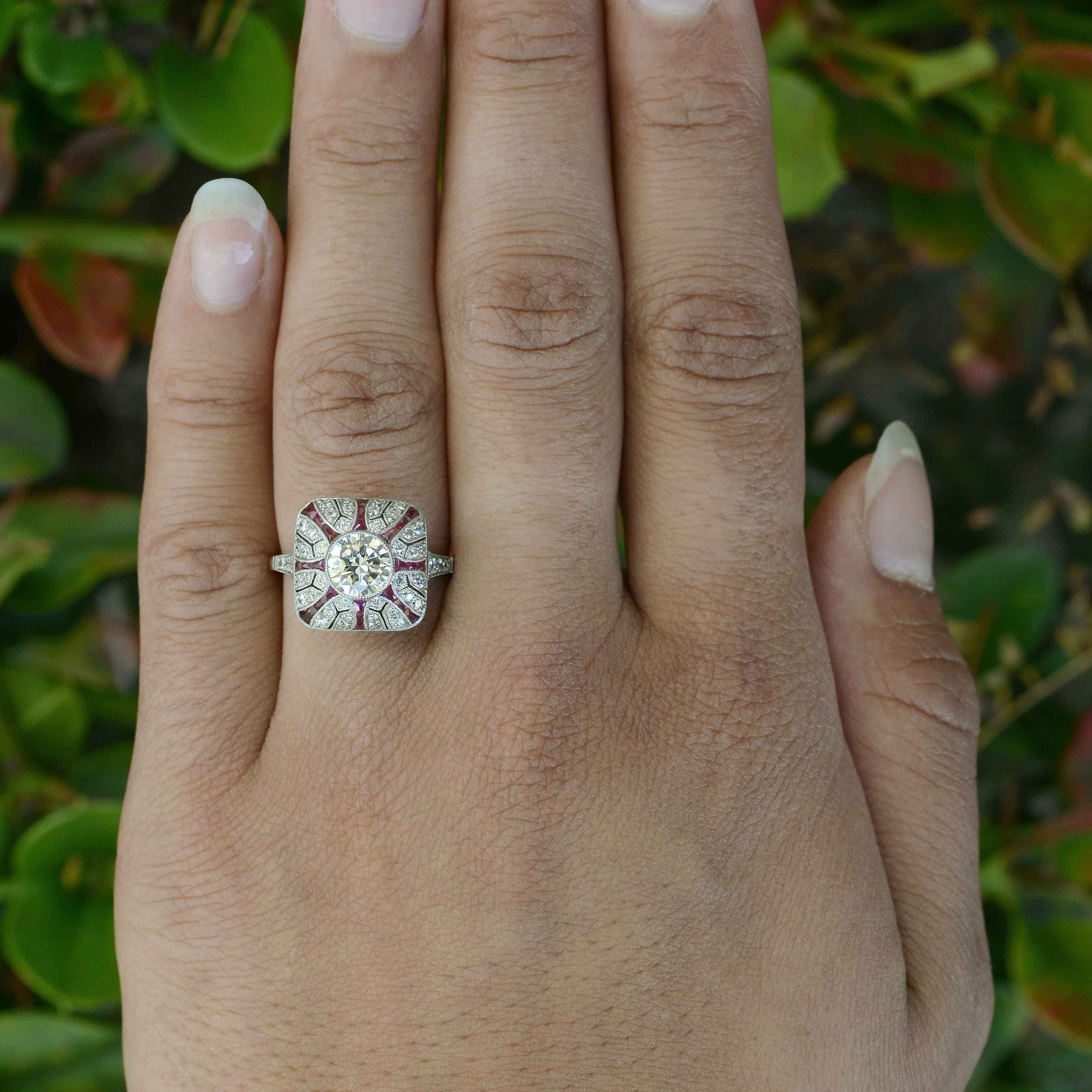 An antique inspired round brilliant diamond Art Deco wedding ring with ruby stripes.