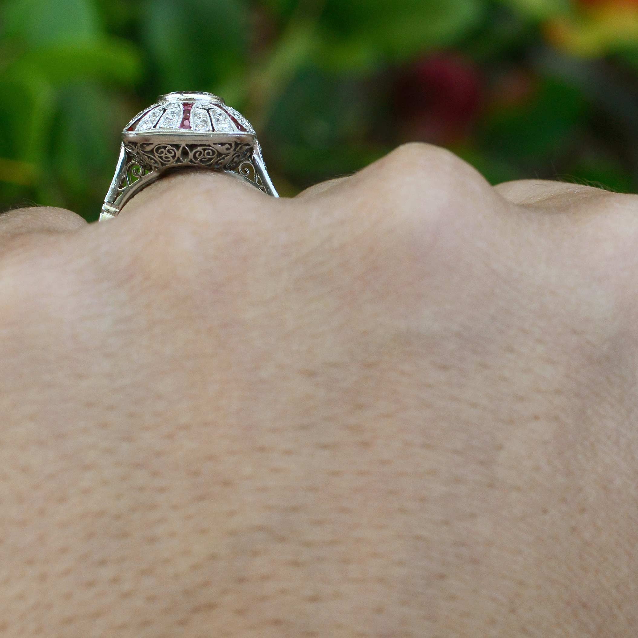 Rubies and diamonds stripe this Art Deco revival, platinum engagement ring.