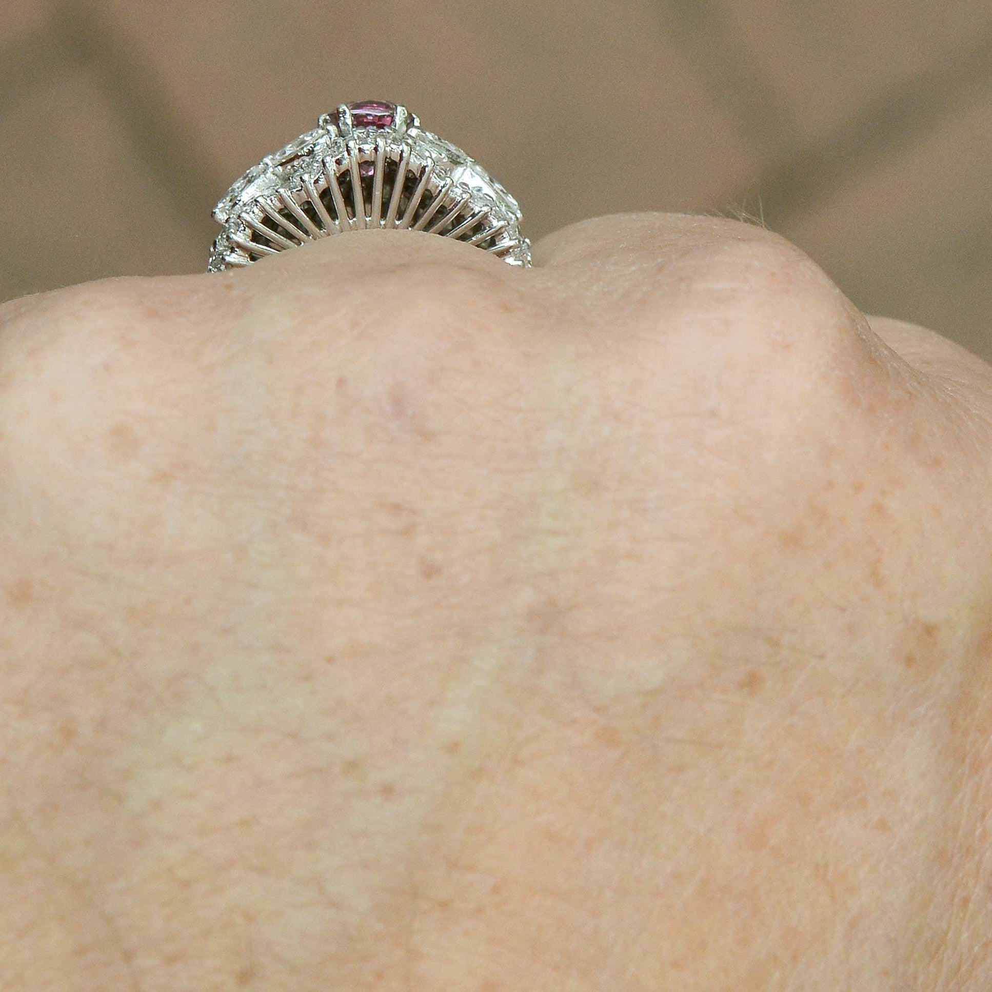 Baguette and marquise cut diamonds accent this mid century pink sapphire platinum ring.