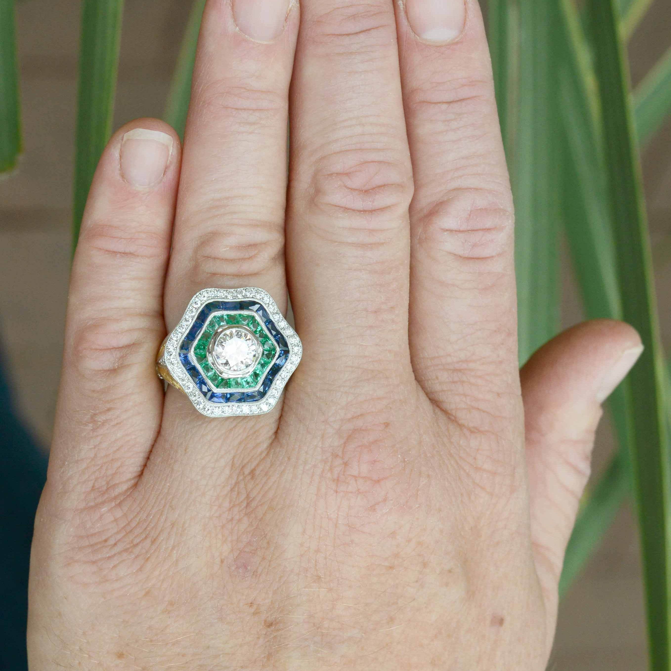 A large hexagon diamond, sapphire and emerald Art Deco statement ring.