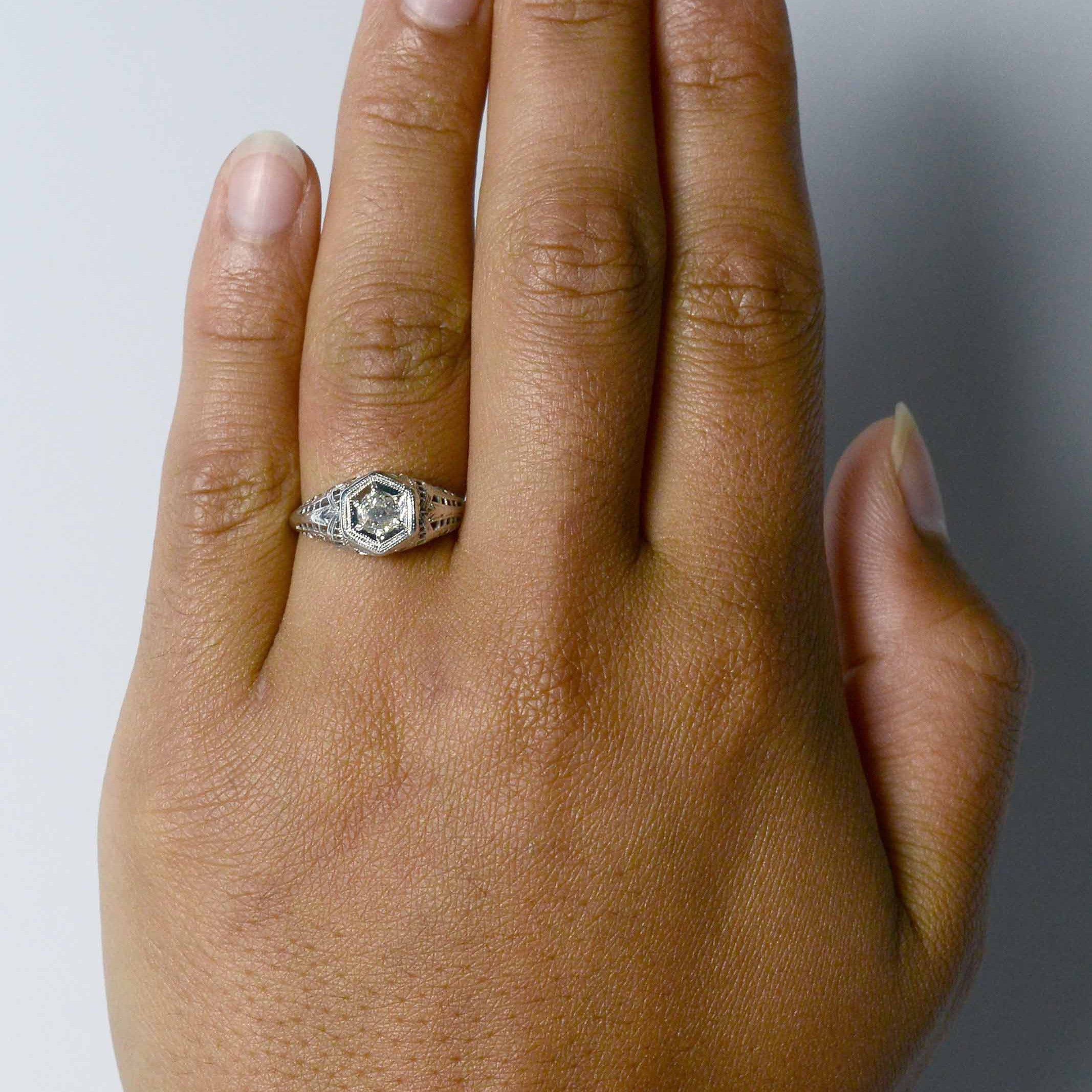 An Edwardian hexagon diamond wedding ring.