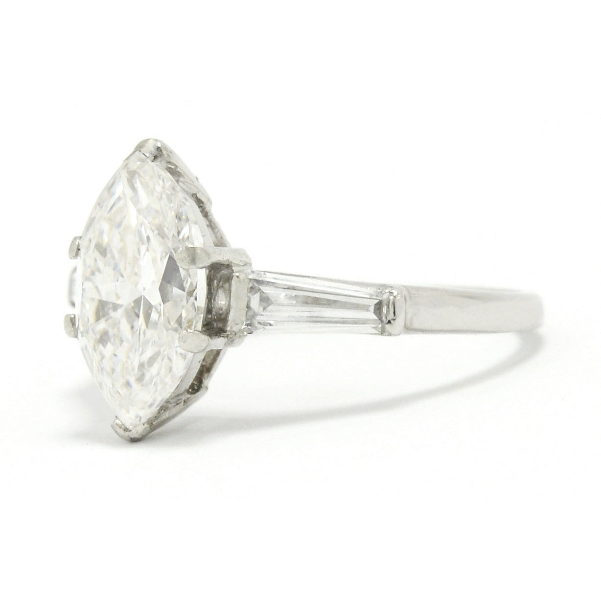 A platinum, antique Art Deco engagement ring with a two carat marquise diamond.