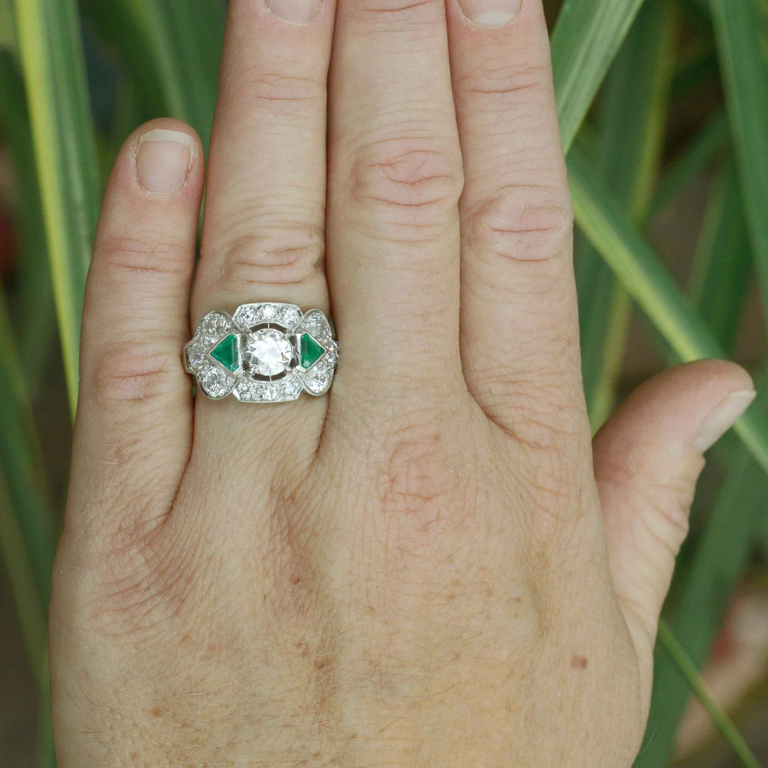 Diamond emerald cluster wedding ring.