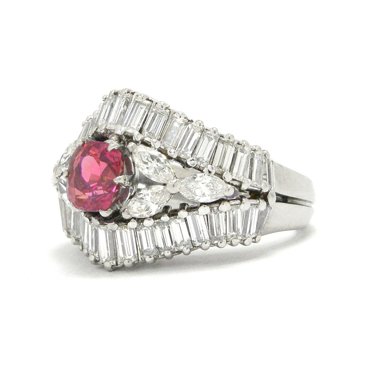 A floral pink sapphire vintage engagement ring by the designer Yanes.